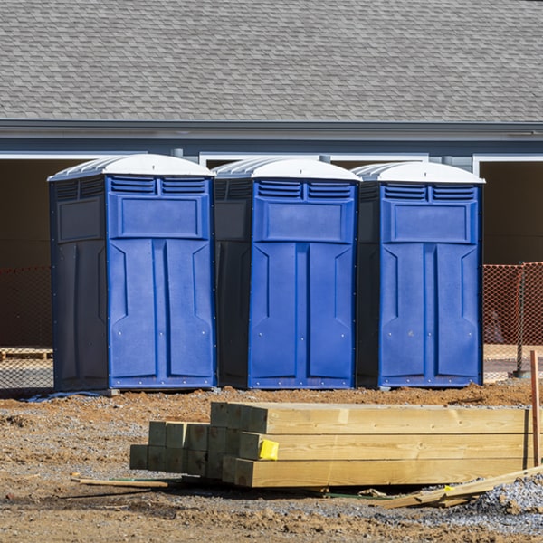 what is the cost difference between standard and deluxe portable toilet rentals in Canova